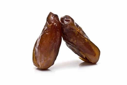 Date fruit isolated over a white background.
