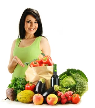 Young woman and groceries isolated on white