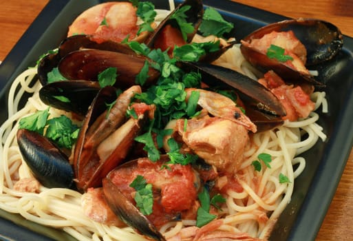 photo of delicious pasta with clams and mussel