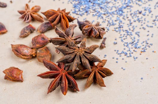 Anise stars close-up on a brown background