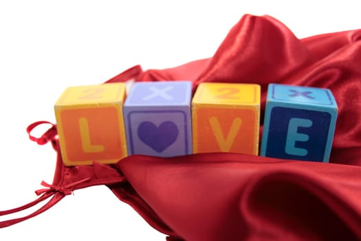 love written with blocks on a silk nightie