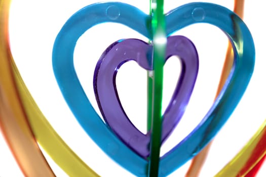 six heart shaped plastic pieces one inside the other on a white background