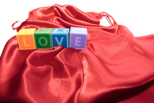 love written with blocks on a silk nightie