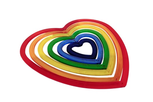six heart shaped plastic pieces one inside the other on a white background with a dark heart inside representing evil