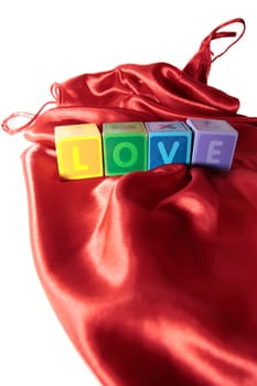 love written with blocks on a silk nightie