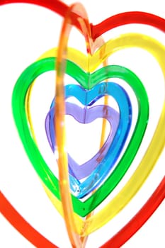 six heart shaped plastic pieces one inside the other on a white background
