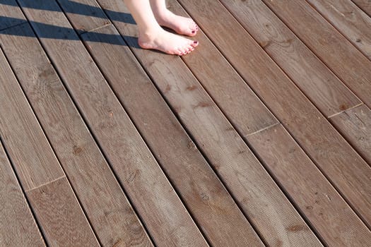 Warm feet on a wooden floor