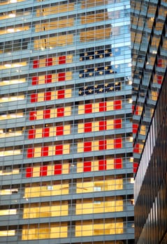 A giant American flag hanging inside a commercial building