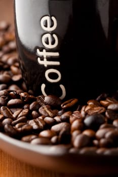 Coffee beans with a mug of coffee