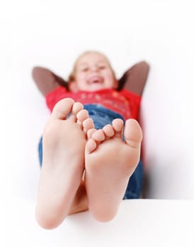 Girl relaxing and smiling on the couch