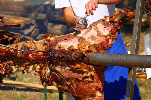 Roasting ox on a fire at a festival