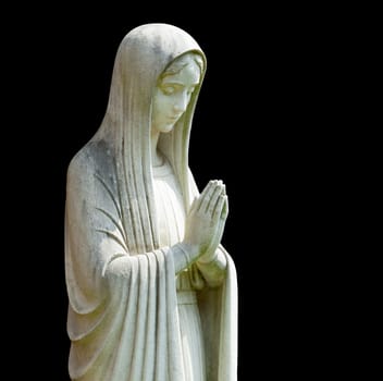 Statue of Mary praying in profile with isolation path and isolated against black