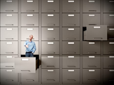young businessman in file cabinet drawer