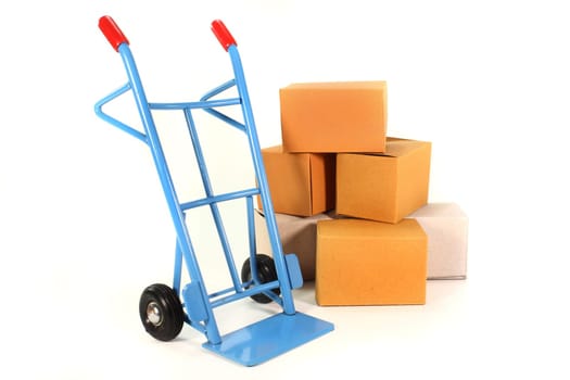 a sack truck and moving boxes against a white background