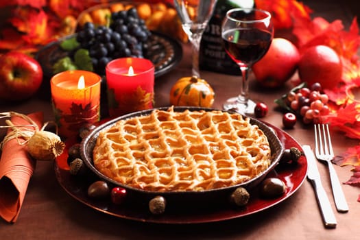 Apple pie for Thanksgiving with wine and grapes