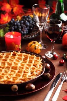 Apple pie for Thanksgiving with wine and grapes