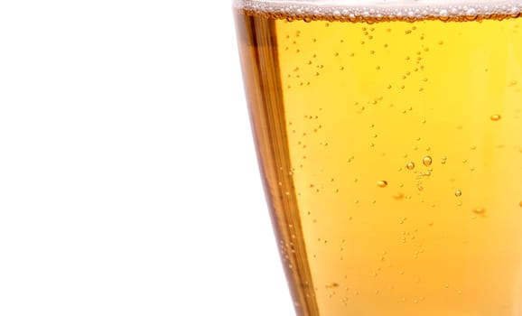 Glass of beer with bubbles on the white background