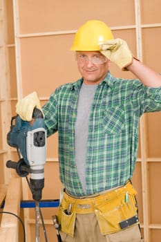 Handyman mature home improvement working with jackhammer diy