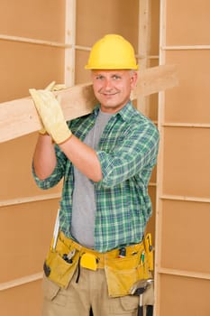 Handyman home improvement carpenter mature professional carry wooden beam