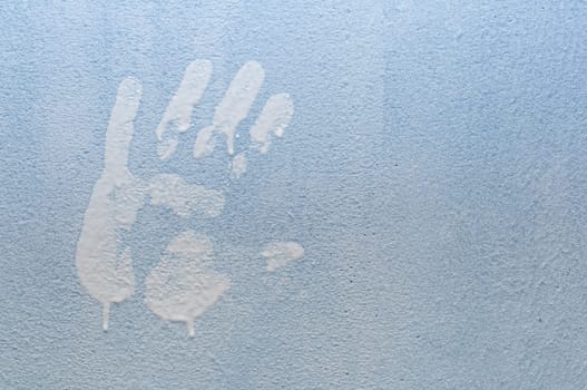 White Hand Print on Light Blue Wall