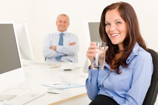 Businesswoman pretty smile sitting in office with male colleague portrait