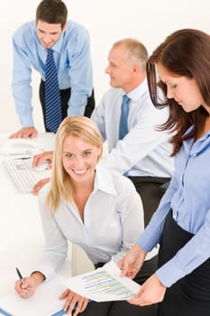 Business team attractive businesswomen with happy colleagues working on charts