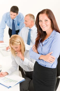 Business team attractive businesswoman with happy colleagues working on charts