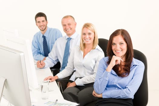 Business team attractive woman sit in line behind computer table