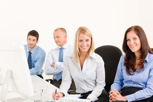 Business team attractive woman sit in line behind computer table