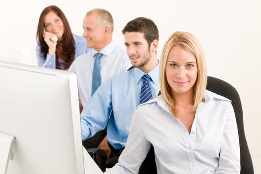 Business team attractive woman sit in line behind computer table