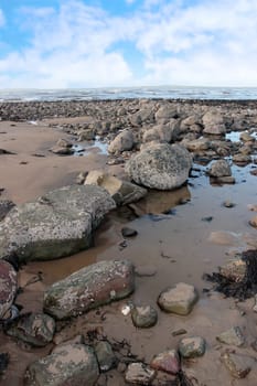 rocks on beale beach co kerry ireland on a cold winters day