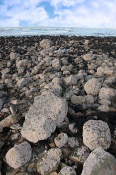 grey boulders and rocks on beale beach co kerry ireland on a cold winters day