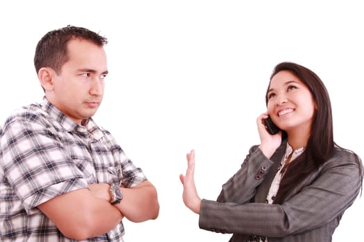 smiling businesswoman on the phone signaling his couple to hold on