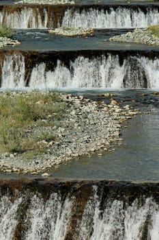Spring water cascades on a mountain river