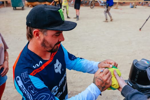 MAYDENA, AUSTRALIA - FEBRUARY 08: Sam HILL of Australia signs autographs after competing in Red Bull Hardline Tasmania on February 8, 2025 in Maydena, Australia.