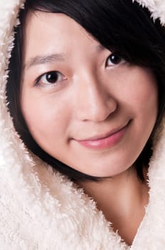 Attractive young woman wearing a fur cape