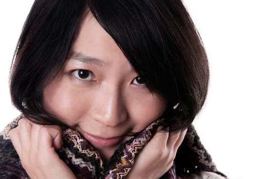 Young asian woman wearing a shawl on white