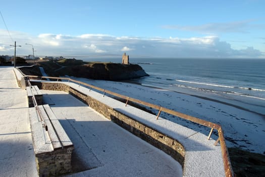 a snowy coastal road in ballybunion ireland