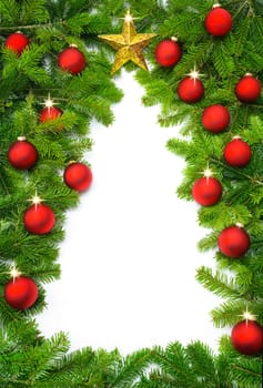 A frame of fir branches and tree decorations forms the outline of a Christmas tree