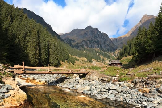 a rustic house near a big mountain
