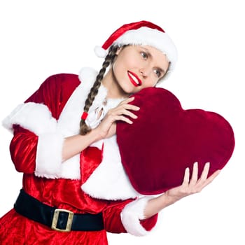 one woman dressed as santa claus holding big heart pillow on studio isolated white background