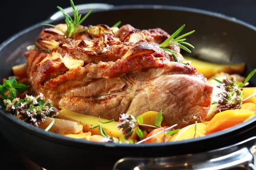 Tasty roasted pork meat with western potatoes and vegetable