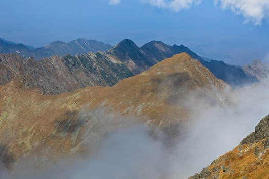 rows of mountains and a sky with clouds, Fagaras mountains, Romania