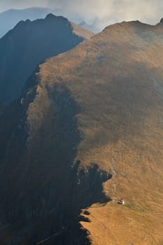 a red refuge on a mountain top
