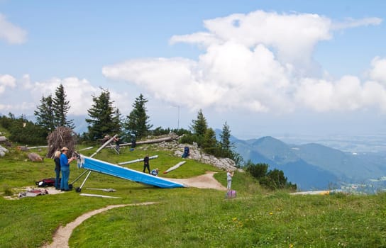 Rupholding, Germany - August 05:  Some people preparing their hangglider for a flight in the German Alps on  August 05, 2009.