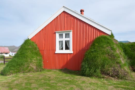 house with a roof covered with grass in iceland