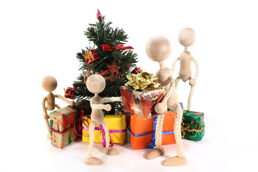 a doll family under the Christmas tree