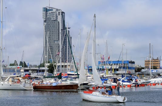 Sailboat entering the marina in gdynia, poland