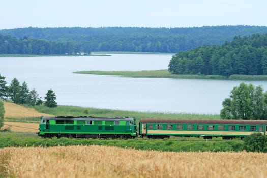 Passenger train passing through the lakeside