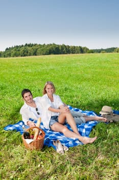 Picnic - Romantic happy couple in meadows nature sunny day